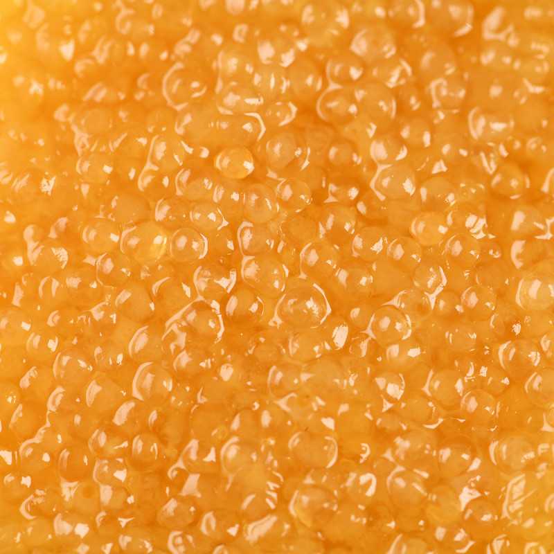 Close-up of KAVIARI pike roe with firm golden grains